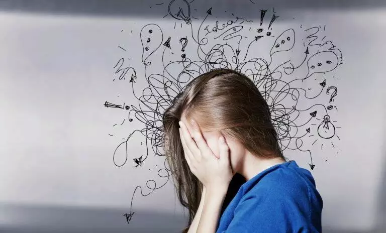 confused woman with images of doodles around her head