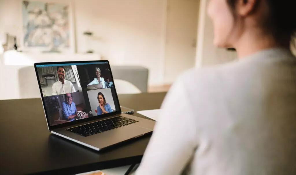 Woman  having a video conference with friends. Family meeting online over a video call.