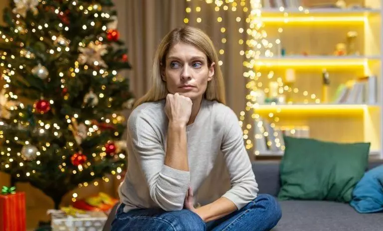 sad woman alone at home for Christmas and New Year
